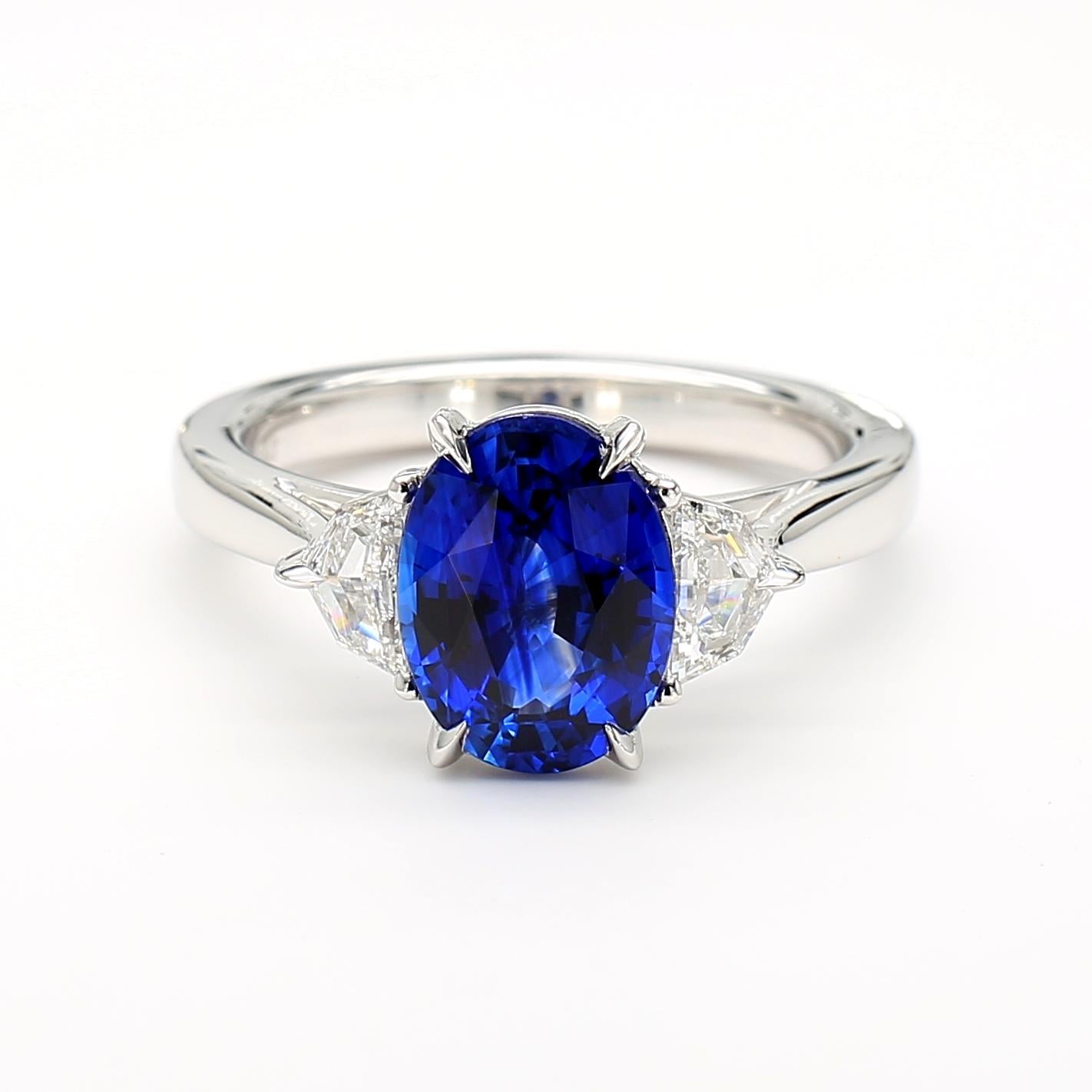 Natural Blue Oval Sapphire and White Diamond 3.27 Carat TW Gold Cocktail Ring