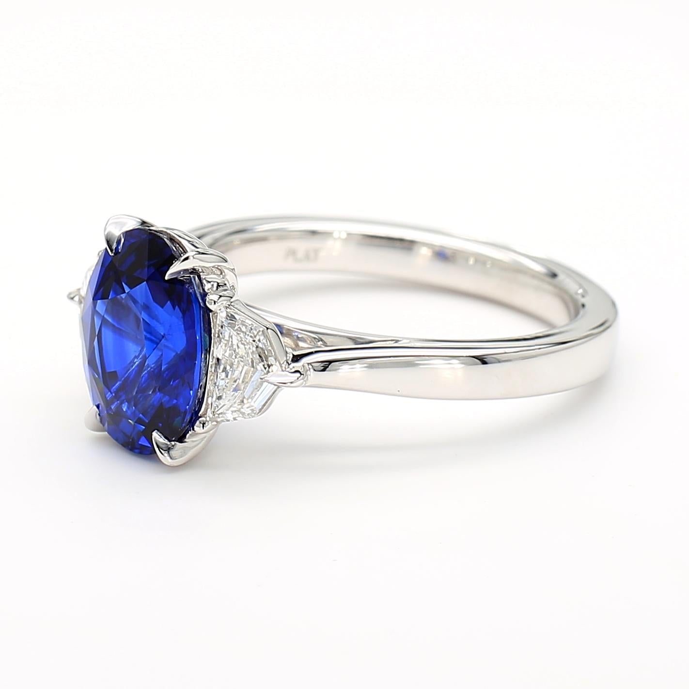 Natural Blue Oval Sapphire and White Diamond 3.27 Carat TW Gold Cocktail Ring