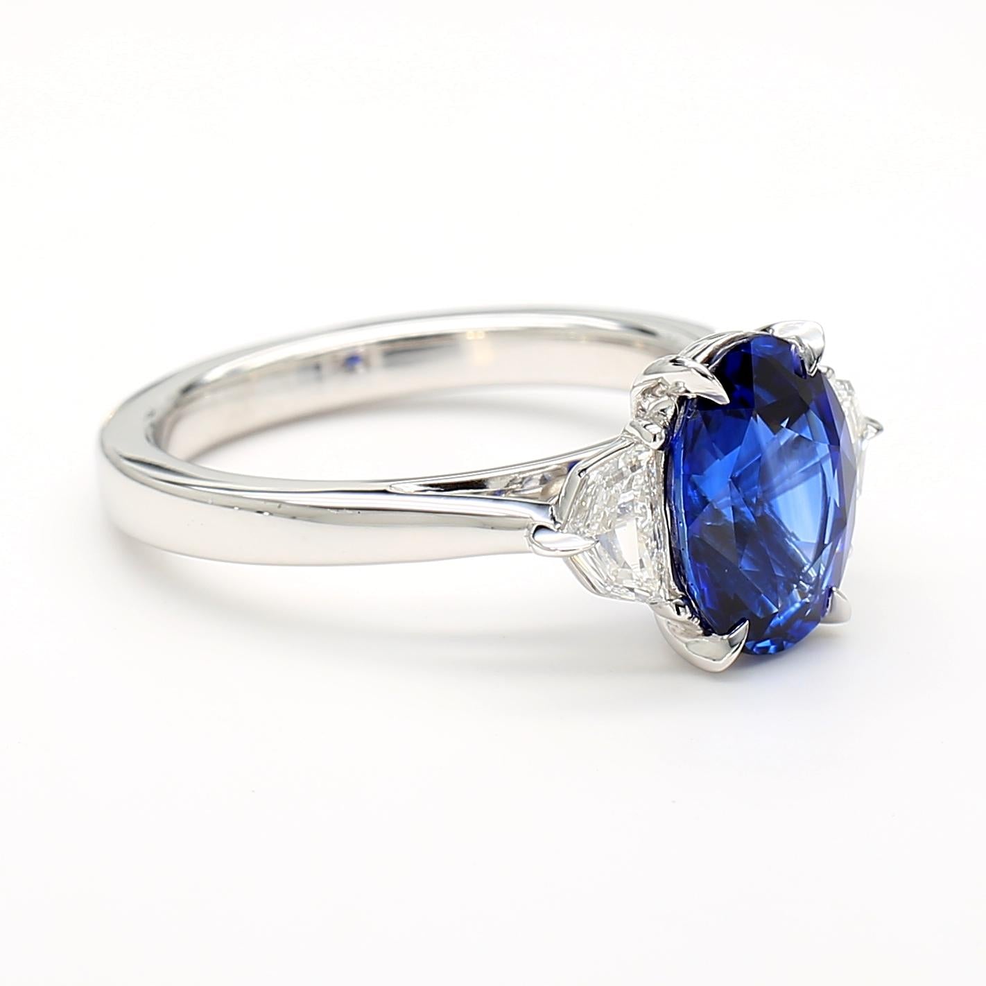 Natural Blue Oval Sapphire and White Diamond 3.27 Carat TW Gold Cocktail Ring
