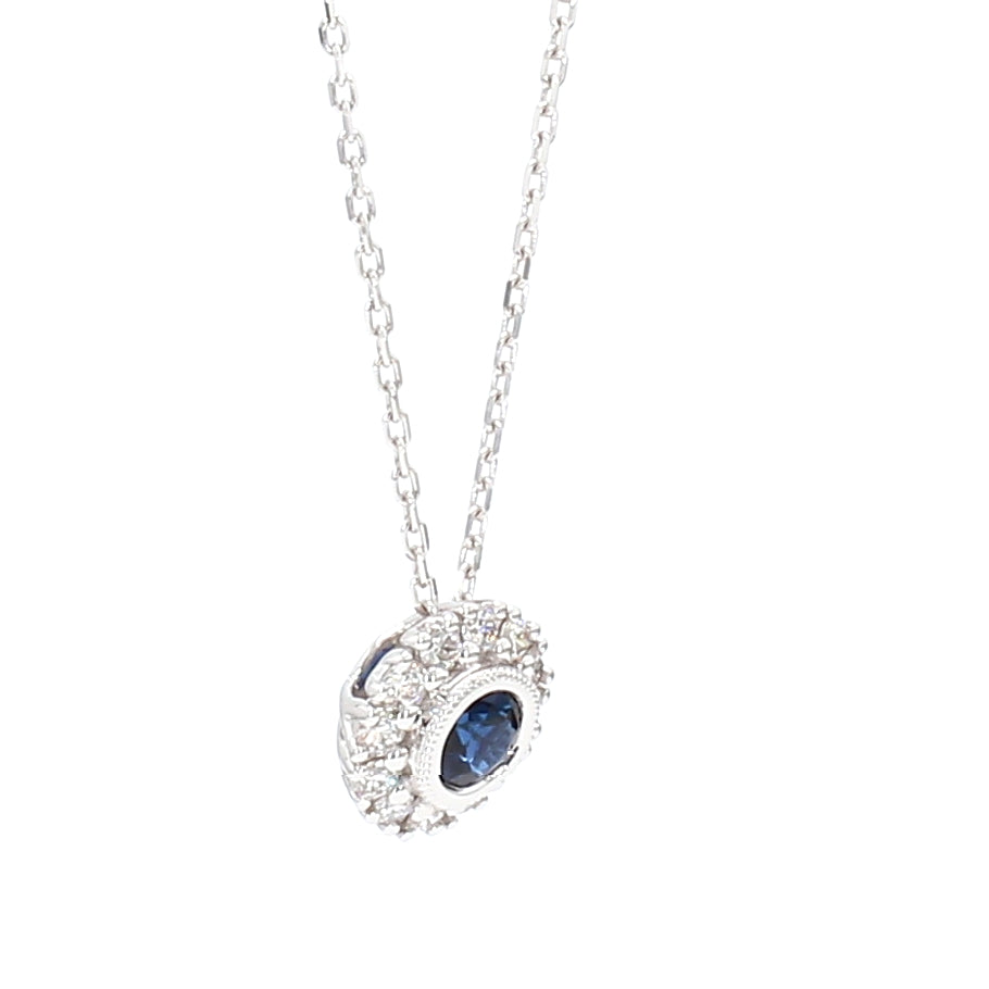 Natural Blue Round Sapphire and Diamond 0.57 Carat TW Gold Pendant