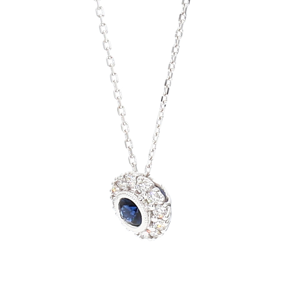 Natural Blue Round Sapphire and Diamond 0.57 Carat TW Gold Pendant