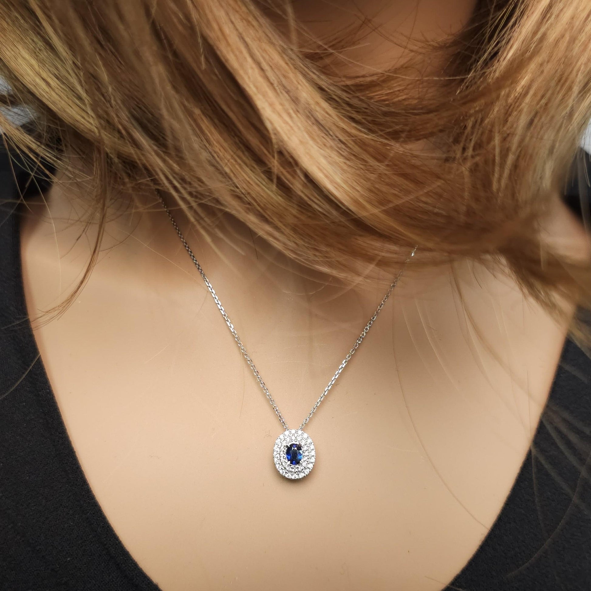 Natural Blue Oval Sapphire and White Diamond .67 Carat TW White Gold Pendant