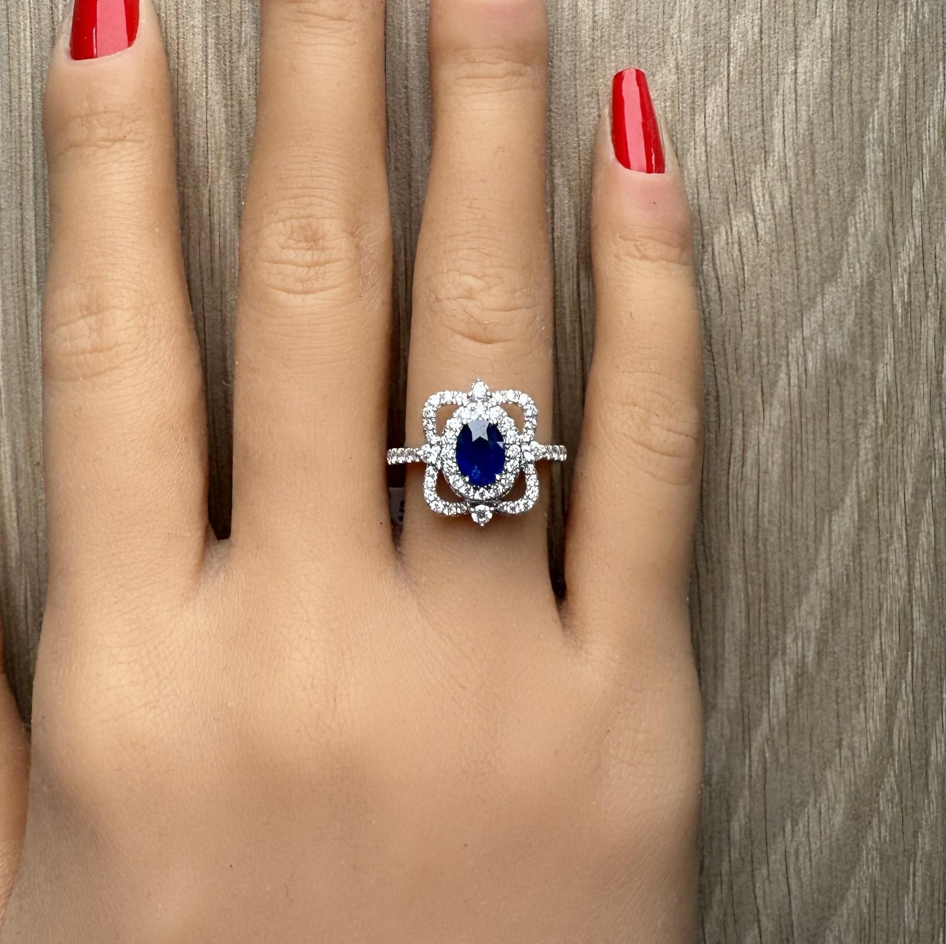 Natural Blue Oval Sapphire and Diamond 1.62 Carat TW Gold Ring